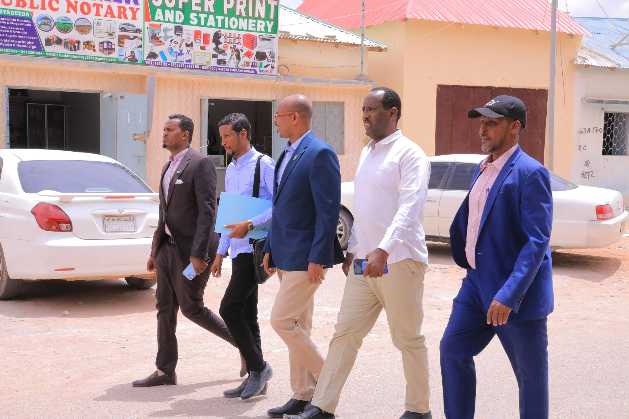 Mideeye public-service team walking through a Puntland street